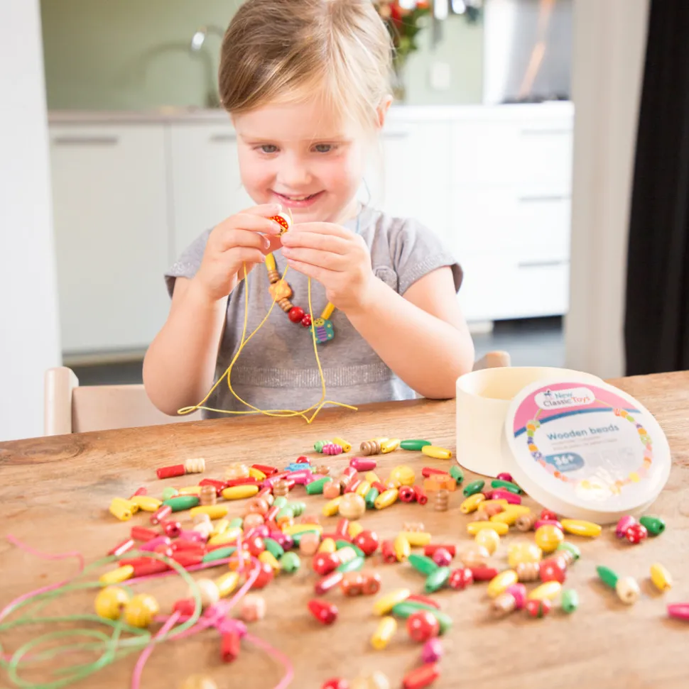 NEW CLASSIC TOYS - Boîte de perles en bois - 100 gr.