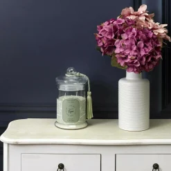 THE HOME DECO FACTORY - Bougie parfumée bonbonnière 13,2 cm vert - senteur figue